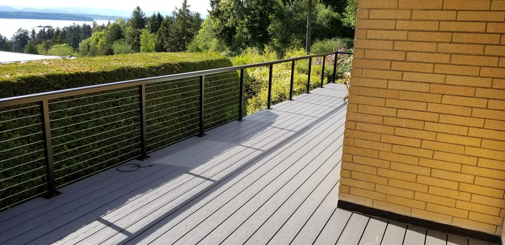 Composite deck with cable railing overlooking Puget Sound waterfront in the Greater Seattle area